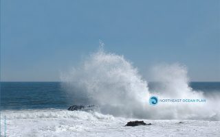 cover photo for northeast ocean plan showing ocean spray and rocks
