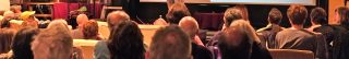 photo of meeting attendees watching a presentation